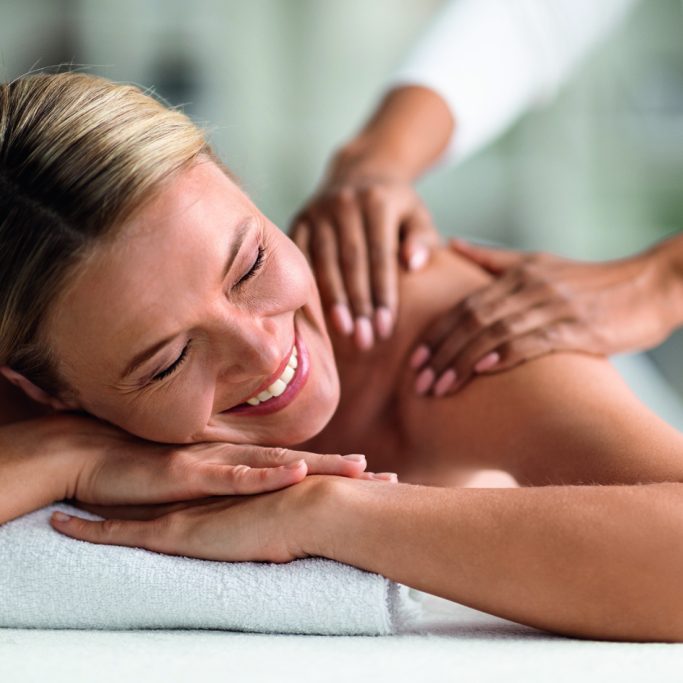 Spa Relax. Beautiful Middle Aged Female Enjoying Massage Session In Wellness Center, Attractive Mature Woman Lying On Table, Getting Relaxing Full Body Treatment In Beauty Salon, Closeup Portrait